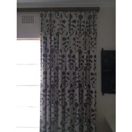 Foral Pinch Pleated Curtains on Dark Wood Pole