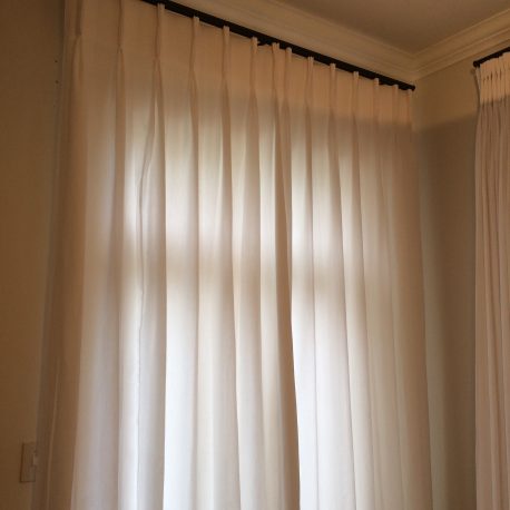Rod/track combo with pinch pleated curtains